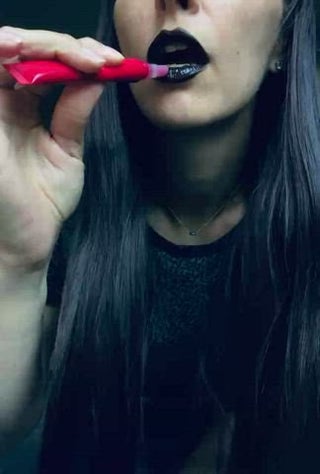 Red gloss on black lipstick. And a very juicy kiss at the end.  [OC] [F40]