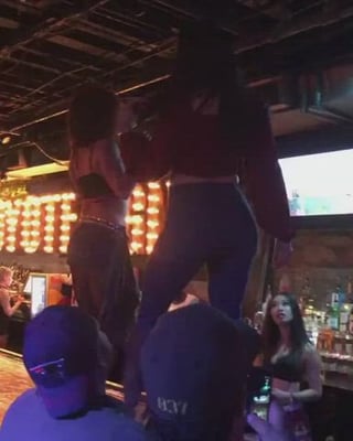 Kendra dancing Coyote Ugly style in a bar