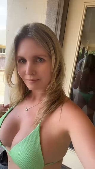 Sweet in a green swimsuit