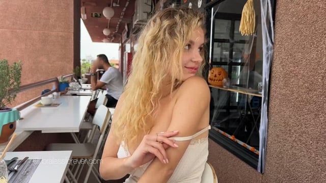 Mila flashing her humongous tits at the restaurant