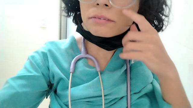 The doctor in the bathroom at work.