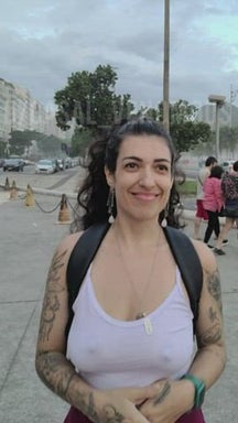 Braless silly walking with friends at the beach